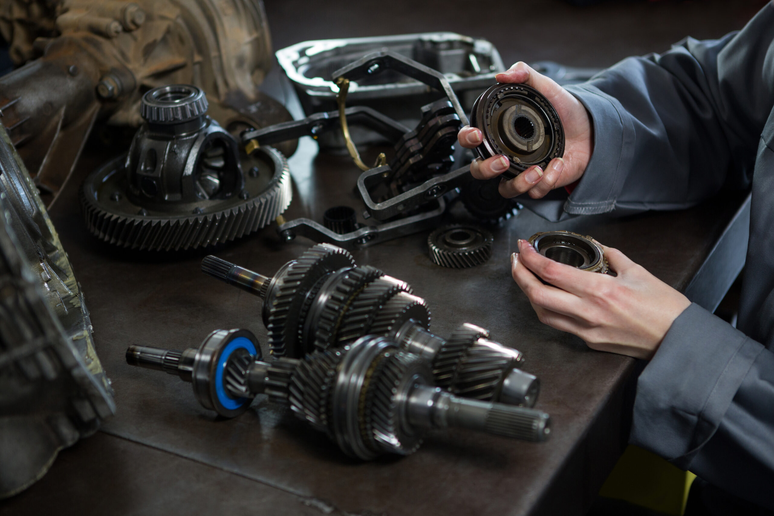 mechanic holding car parts