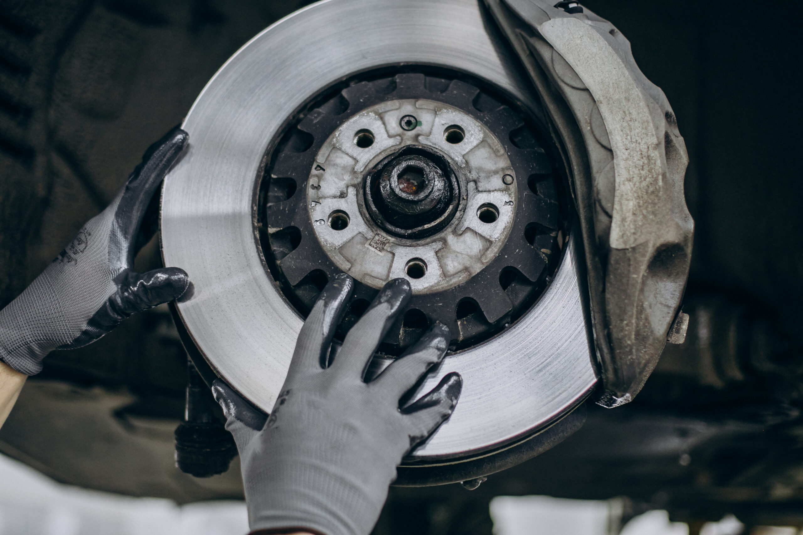 mechanic changing brake